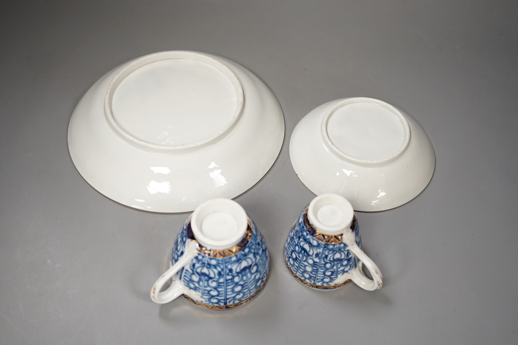Chamberlains Worcester Armorial teawares, coffee cup, teacup and saucer and a saucer shaped dish, centres with the crest of a stag